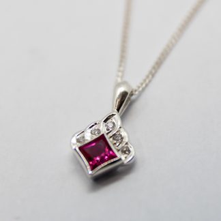 Stg Red Cubic Zirconian with a White CZ Pendan_0